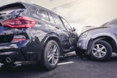 Car crash dangerous accident on the road. SUV car crashing beside another one on the road..