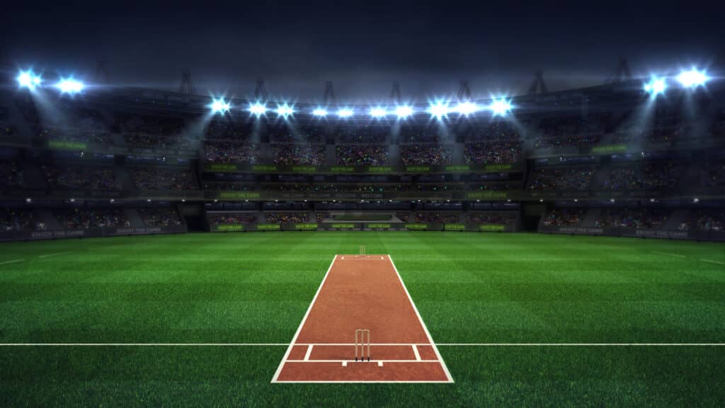 Illuminated,Round,Cricket,Stadium,Full,Of,Fans,At,Night,Upper