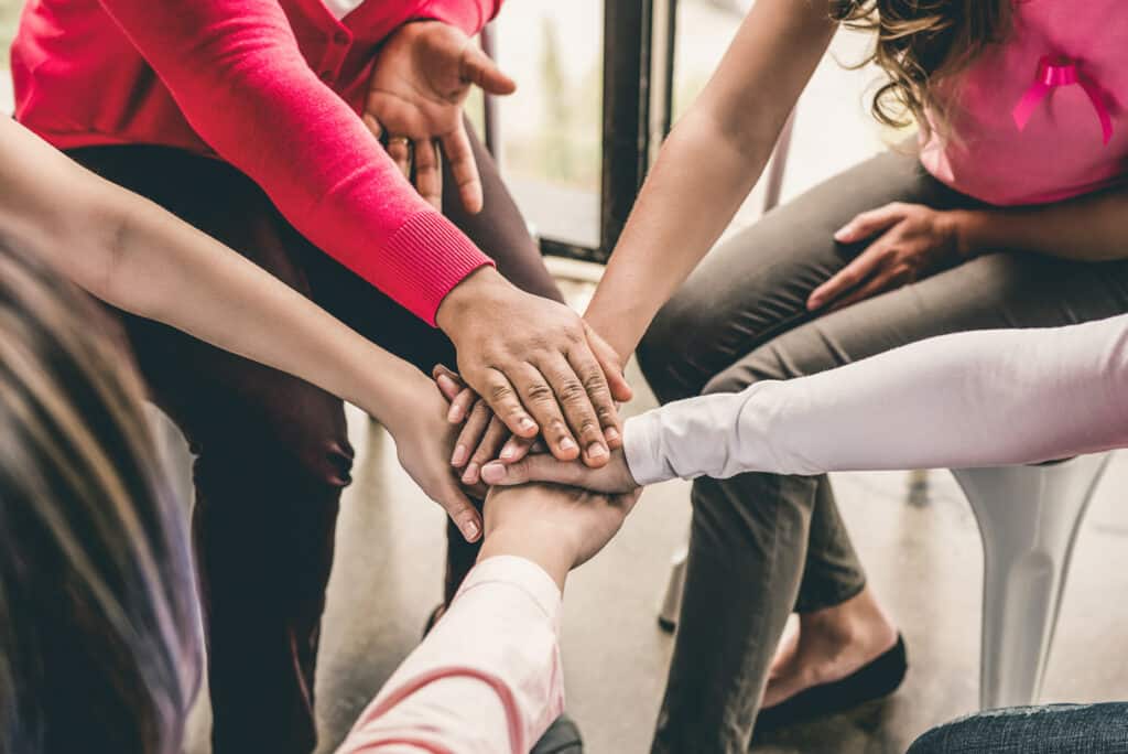 Group,Of,Diverse,Women,Put,Their,Hands,Together,In,Stack