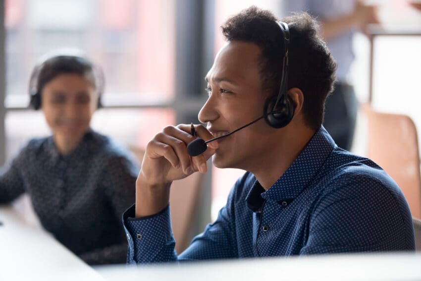 Smiling,Young,African,Businessman,Call,Center,Agent,Wear,Wireless,Headset