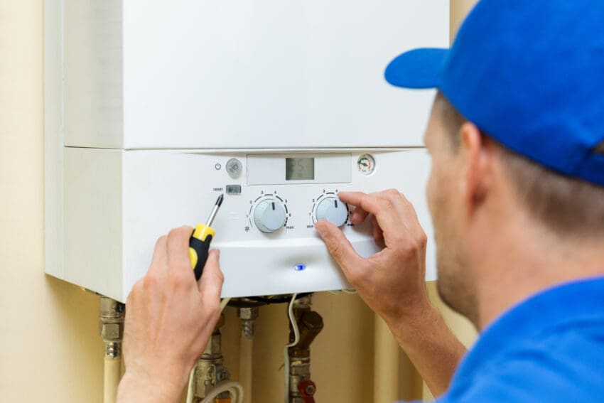 Worker,Set,Up,Central,Gas,Heating,Boiler,At,Home