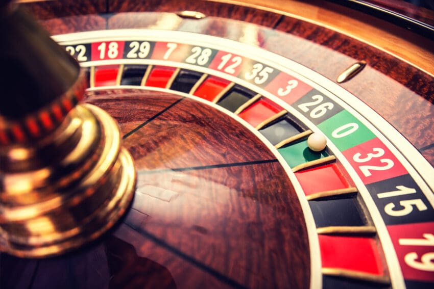 Roulette,Wheel,In,Casino,With,Ball,On,Green,Position,Zero.