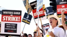 Screenwriters in the US say they have reached a tentative deal with studio bosses that could see them end a strike that has lasted nearly five months.